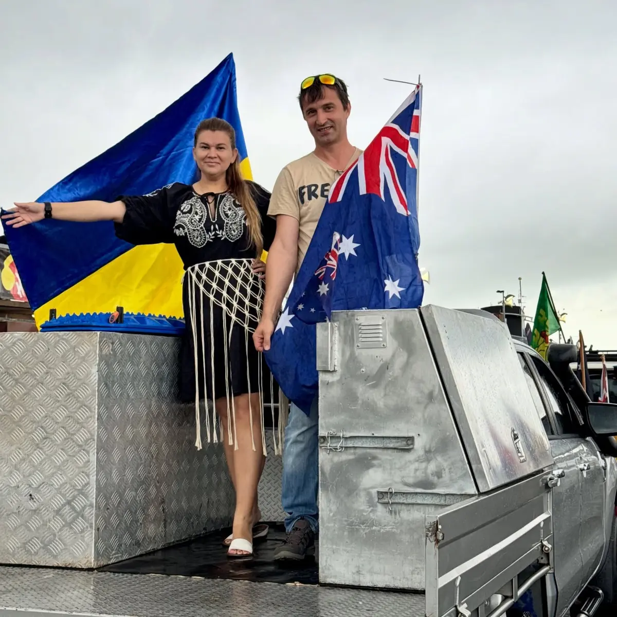 Ukrainian community members displaying both national flags at the Ute Run