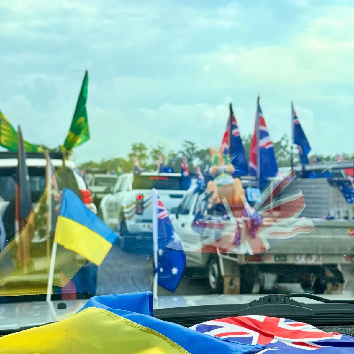 Australia Day convoy filled with flags leaving Hidden Valley Raceway